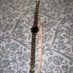 Bulova watch women’s style thin clock gold